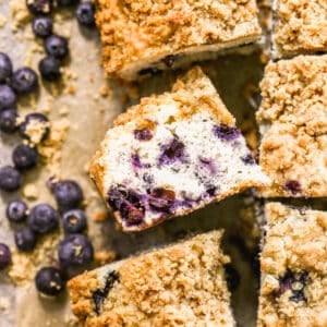 A slice of Blueberry Coffee Cake on it's side to show all the blueberries.
