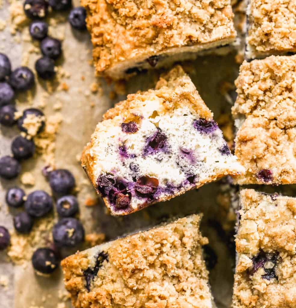 A slice of Blueberry Coffee Cake on it's side to show all the blueberries.