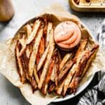 A basket of homemade french fries with fry sauce for dipping.