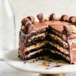 The best Chocolate Peanut Butter Cake recipe tastes professional but couldn't be easier to make with moist cake layers, fluffy peanut butter filling, and smooth chocolate frosting.