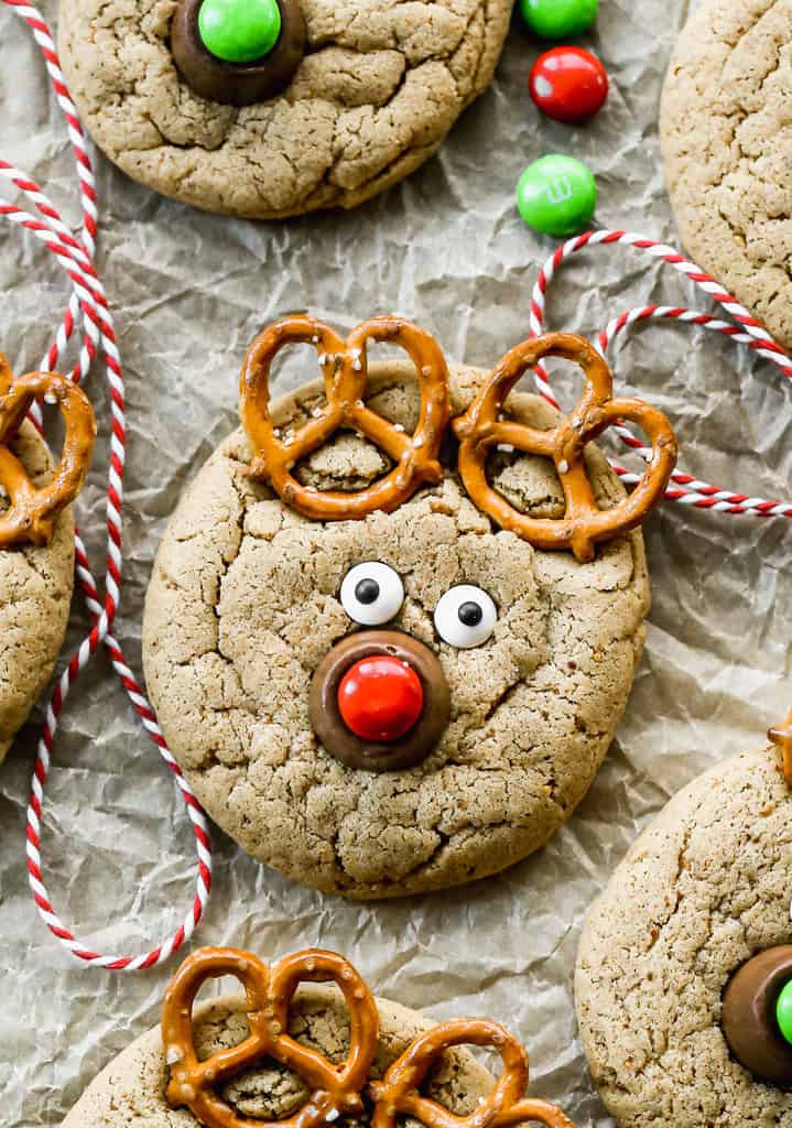 A Reindeer cookie made with a baked peanut butter cookie, pretzels for the antlers, and a rolo and m&m candy for the nose.