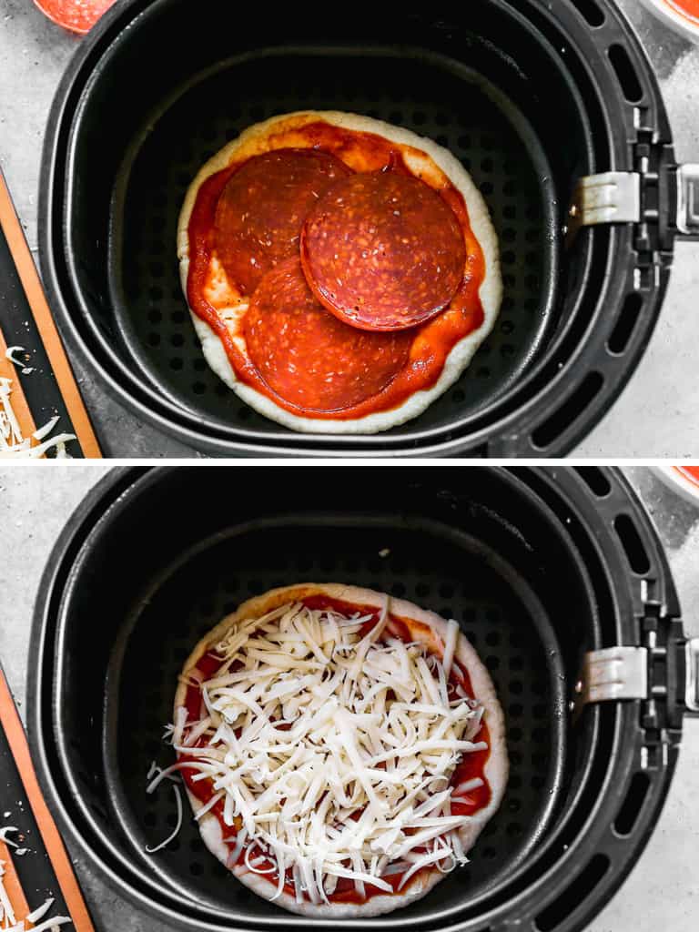 Pizza dough in an air fryer basket topped with sauce and pepperonis, then cheese.