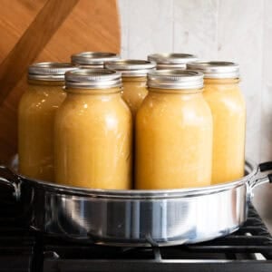 Canning Applesauce is the easiest canning recipe for beginners! Only 2 ingredients: apples and water! It's easy and delicious to stock your pantry with fresh applesauce all year!