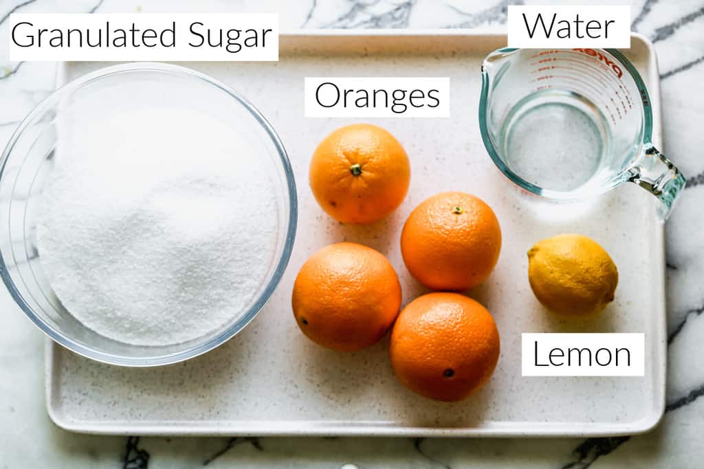 The four ingredients needed to make orange marmalade.
