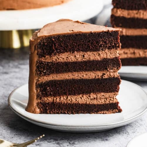This easy Chocolate Mousse cake has layers of moist chocolate cake and a creamy homemade chocolate mousse, topped with a smooth chocolate frosting. It's elegant, delicious, and perfect for any occasion!