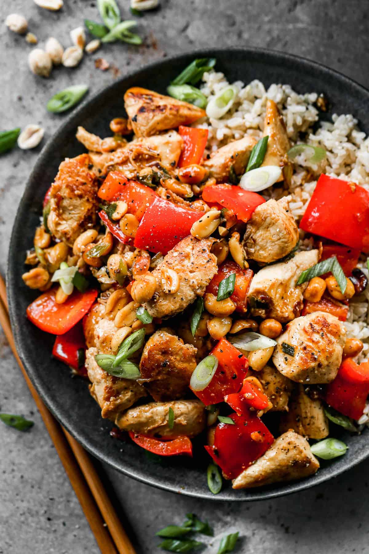 This easy Kung Pao Chicken recipe tastes better than takeout! It has tender chicken and peanuts in a flavorful homemade sauce and served over rice. 
