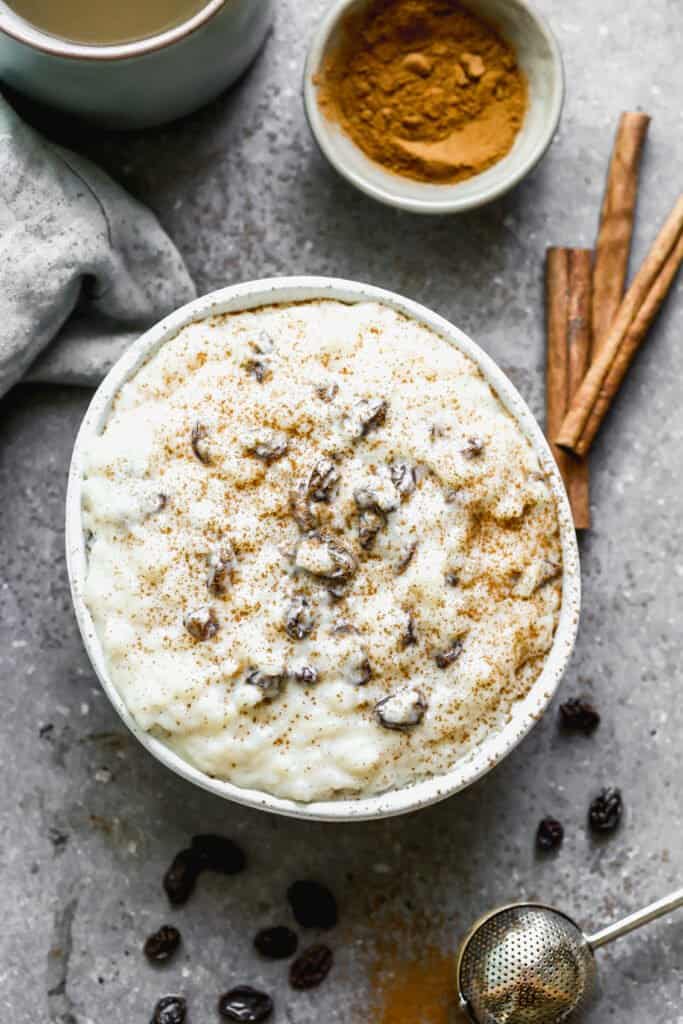 Arroz con leche served in a bowl, with a sprinkle of cinnamon on top.