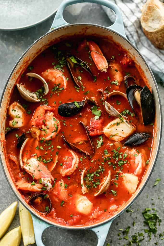 A large pot of homemade authentic Cioppino soup with crab, clams, mussels, shrimp and fish.