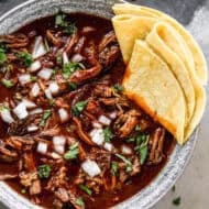 The best Mexican Beef Birria recipe has a rich and flavorful broth and fall-apart tender meat. It's absolutely delicious!