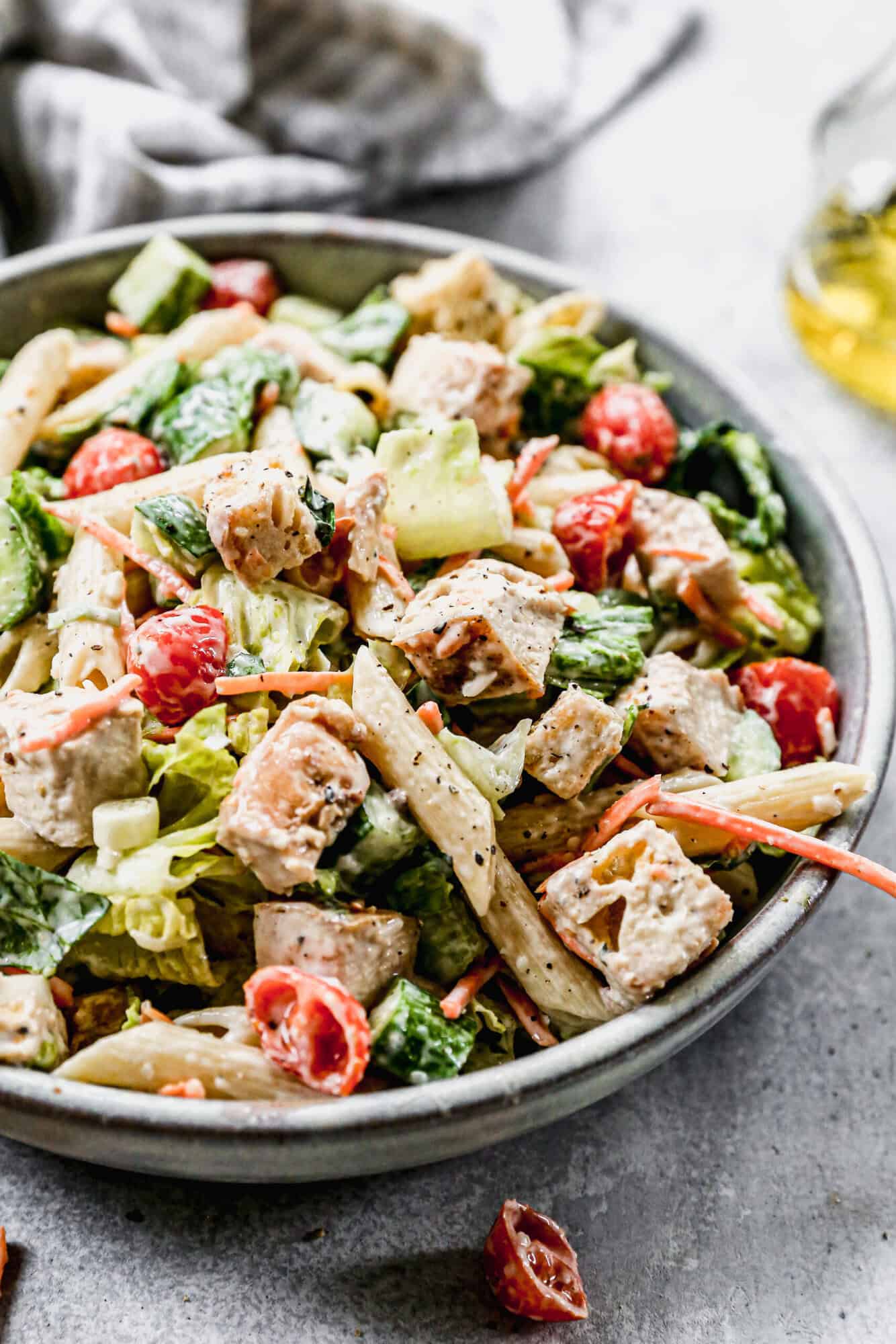 This high protein chicken caesar pasta salad recipe has everything you love about caesar salad with pasta to make it a hearty, fresh, and light meal perfect for summer!
