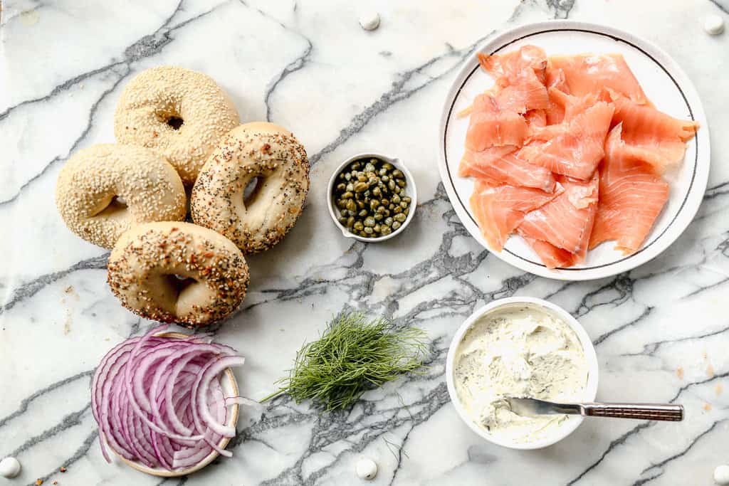All the ingredients to make lox bagels.