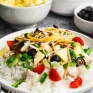 This easy Hawaiian Haystacks recipe has a homemade gravy with chicken on a bed of rice topped with all of your favorite toppings. It's fresh, healthy, and tastes so much better than anything from a can!