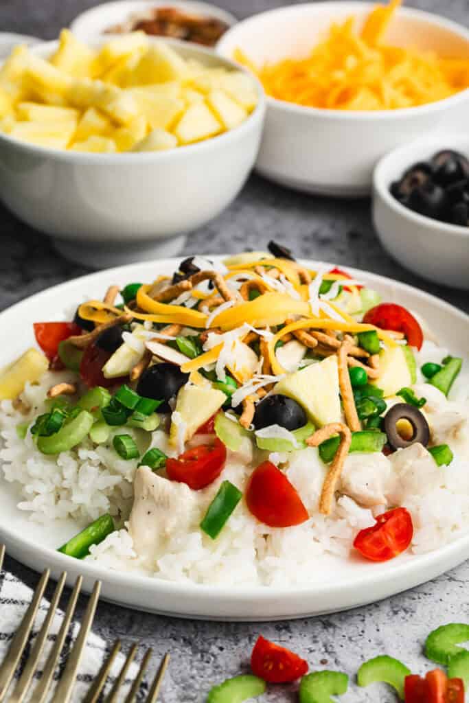 This easy Hawaiian Haystacks recipe has a homemade gravy with chicken on a bed of rice topped with all of your favorite toppings. It's fresh, healthy, and tastes so much better than anything from a can!