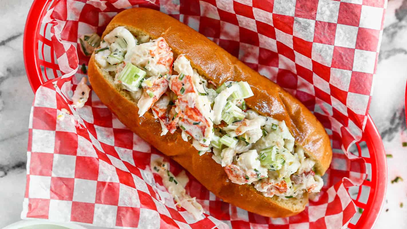 This easy Lobster Roll recipe has warm lobster tossed in a light sauce and served on a toasted bun. It's easier to make than you think and is worth every minute of prep!