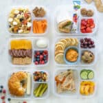 Six lunches in divided containers to show a variety of school lunch ideas.