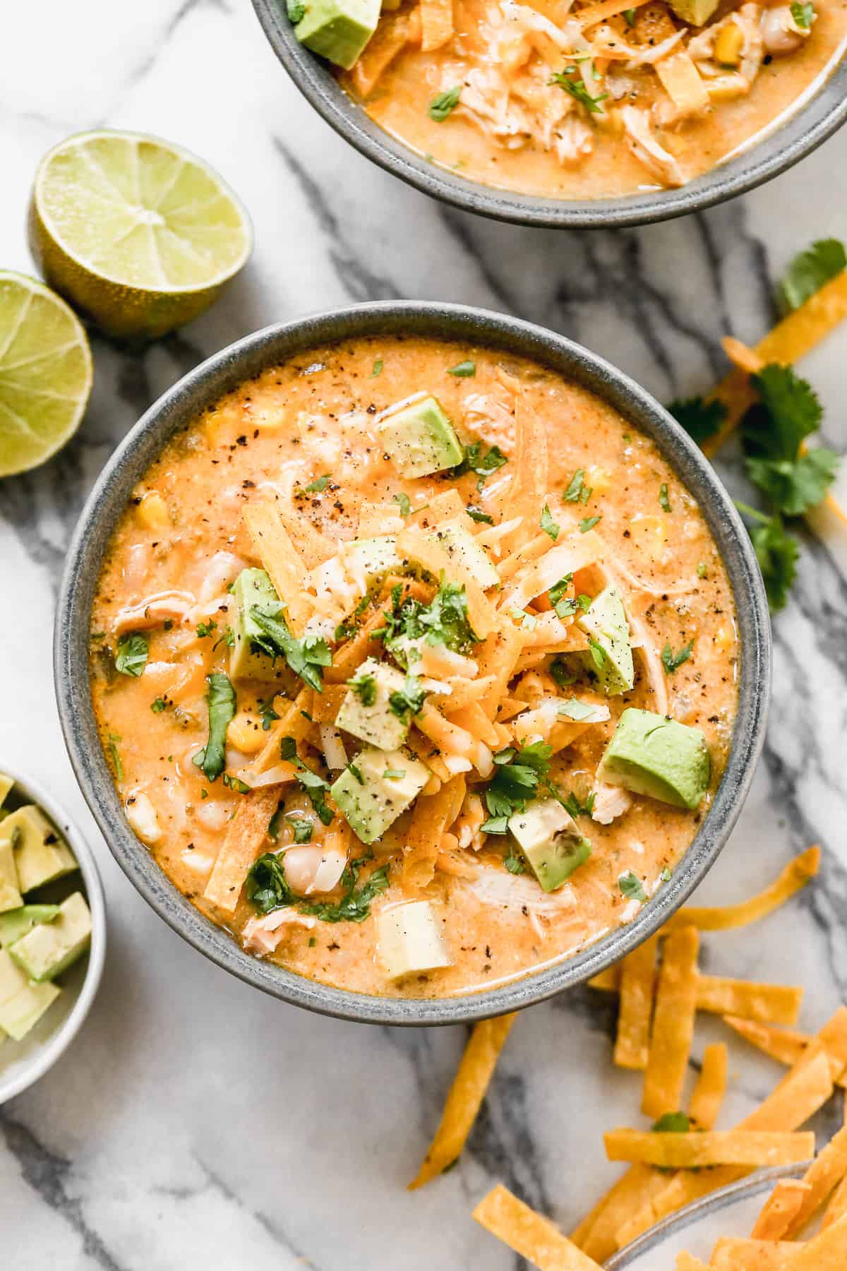 A bowl of creamy White Chicken Chili with toppings, ready to enjoy.