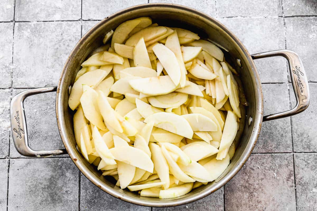 A pot filled with peeled apple slices for homemade Apple Pie. 