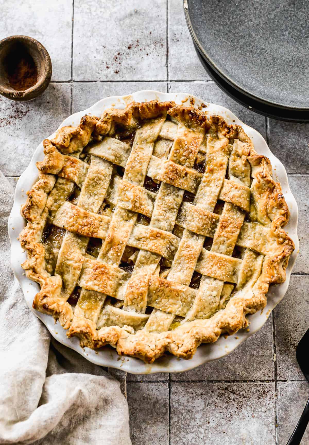 A baked Apple Pie with a lattice crust, fresh out of the oven. 