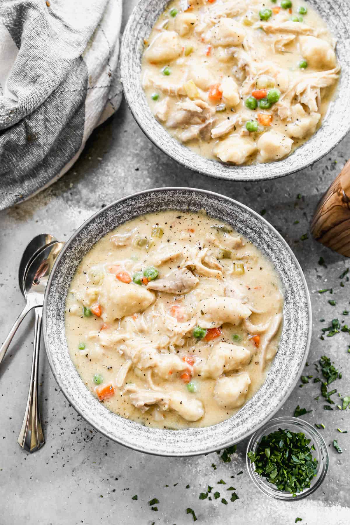 Two bowls of homemade Chicken and Dumplings, ready to eat.