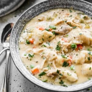 This easy Chicken and Dumplings recipe has a creamy soup with veggies and drop style homemade dumplings that are incredible! This is a family favorite soup that is filling and comforting!