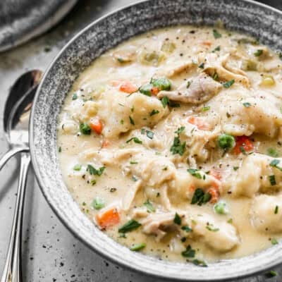 This easy Chicken and Dumplings recipe has a creamy soup with veggies and drop style homemade dumplings that are incredible! This is a family favorite soup that is filling and comforting!
