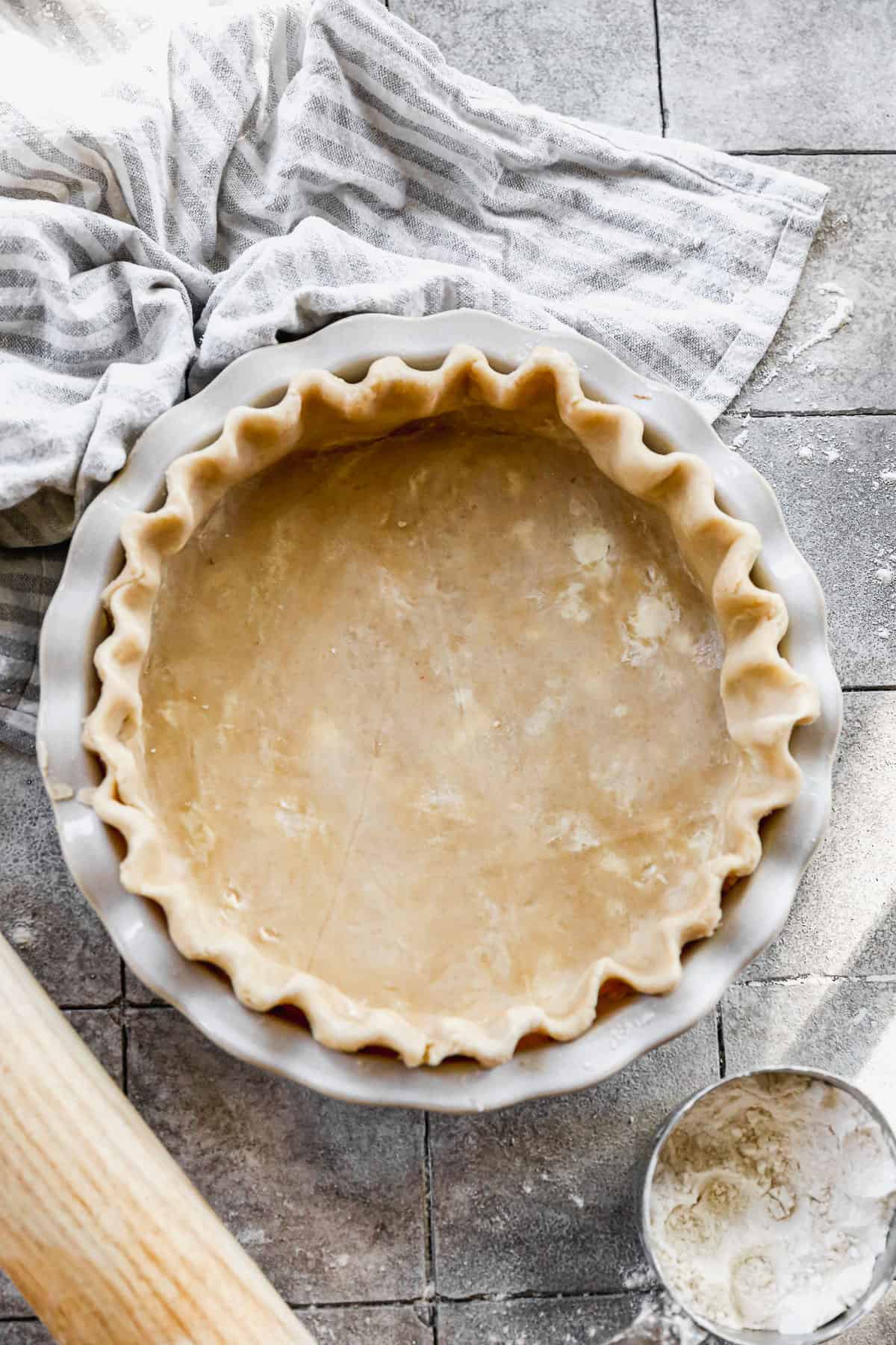 The best homemade Pie Crust recipe in a pie pan, ready to bake!