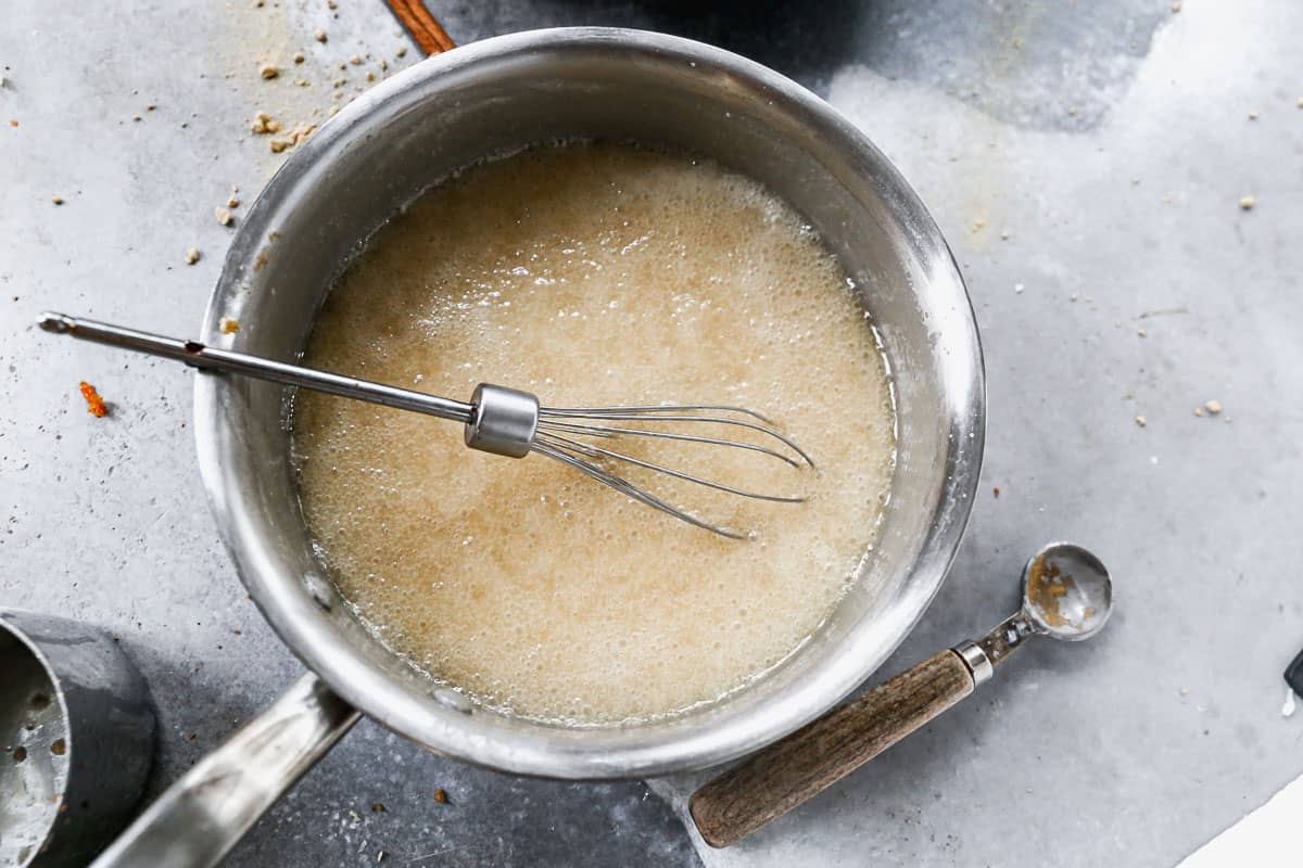 Homemade vanilla syrup being boiled in a saucepan.