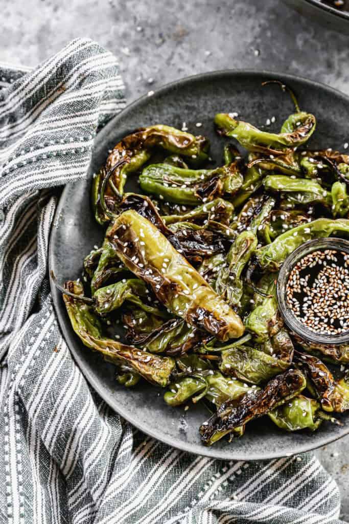 The best Blistered Shishito Peppers recipe is sweet, spicy, and the most impressive appetizer you can make in 10 minutes!