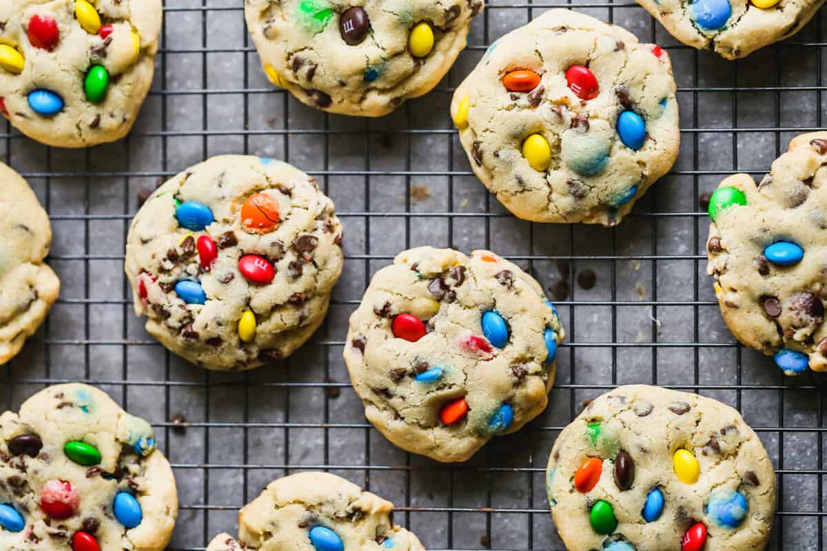 Freshly baked M&M Cookies on a cooling rack.