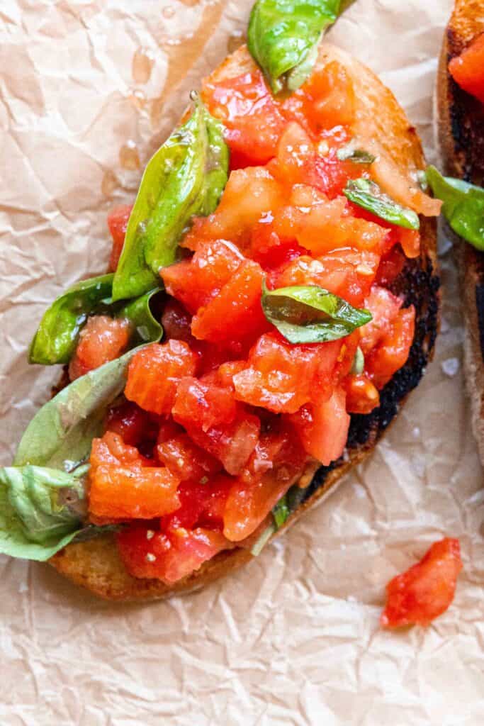 Italian Bruschetta served with fresh tomato and basil mixture on top.
