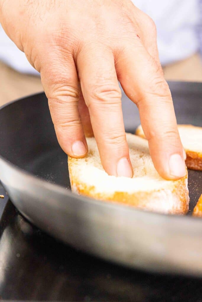 Bread toasting in a pan.