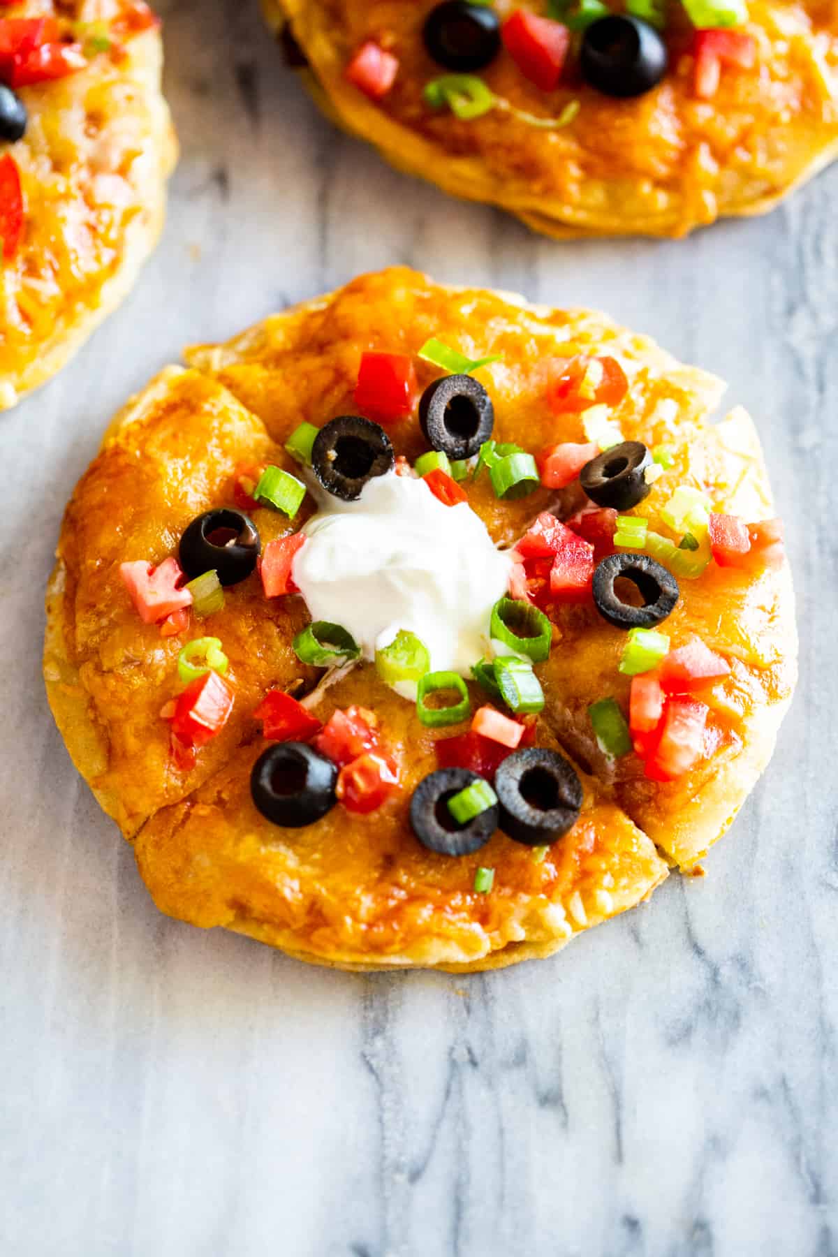 These easy Mexican Pizzas are even BETTER (and healthier) than the ones you love from Taco Bell! You can now satisfy your craving anytime!