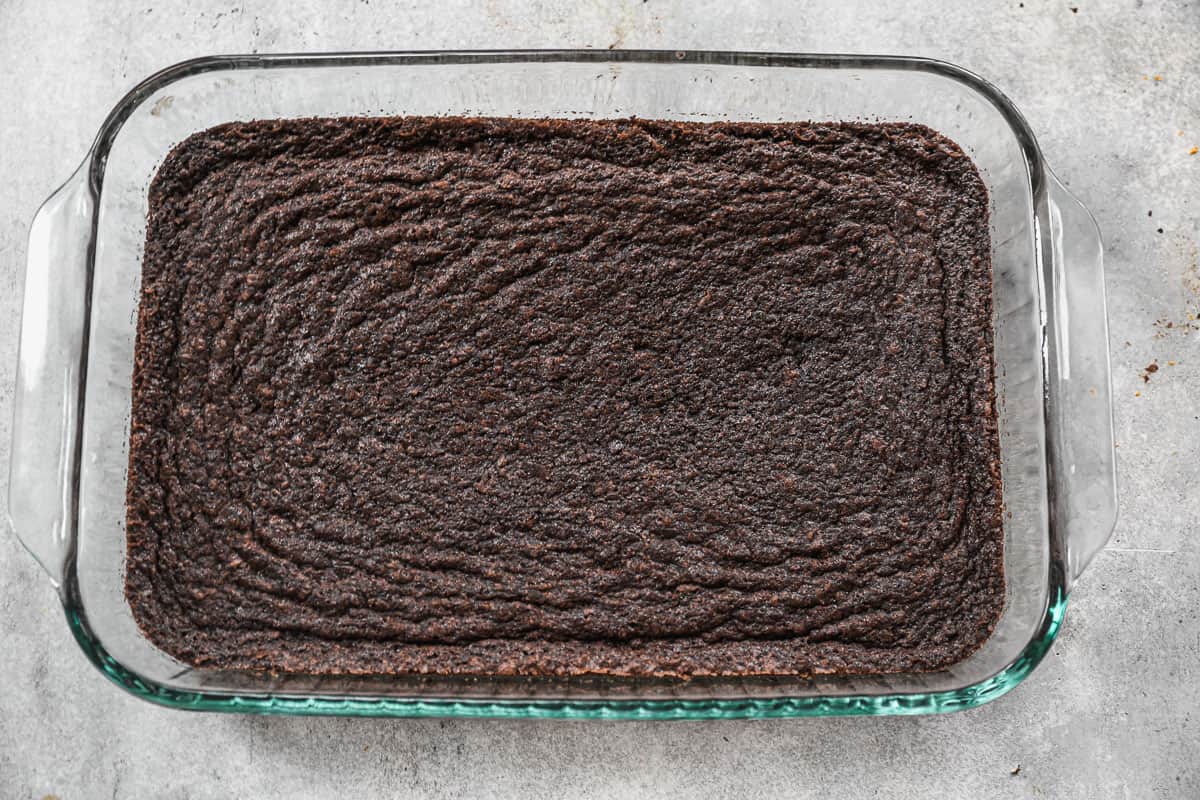 A glass 9x13 baking pan filled with homemade brownies, fresh from the oven.