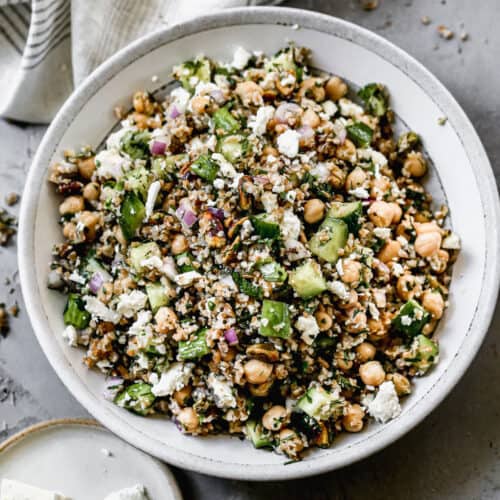 A large white serving bowl filled with an easy Bulgur Salad recipe.