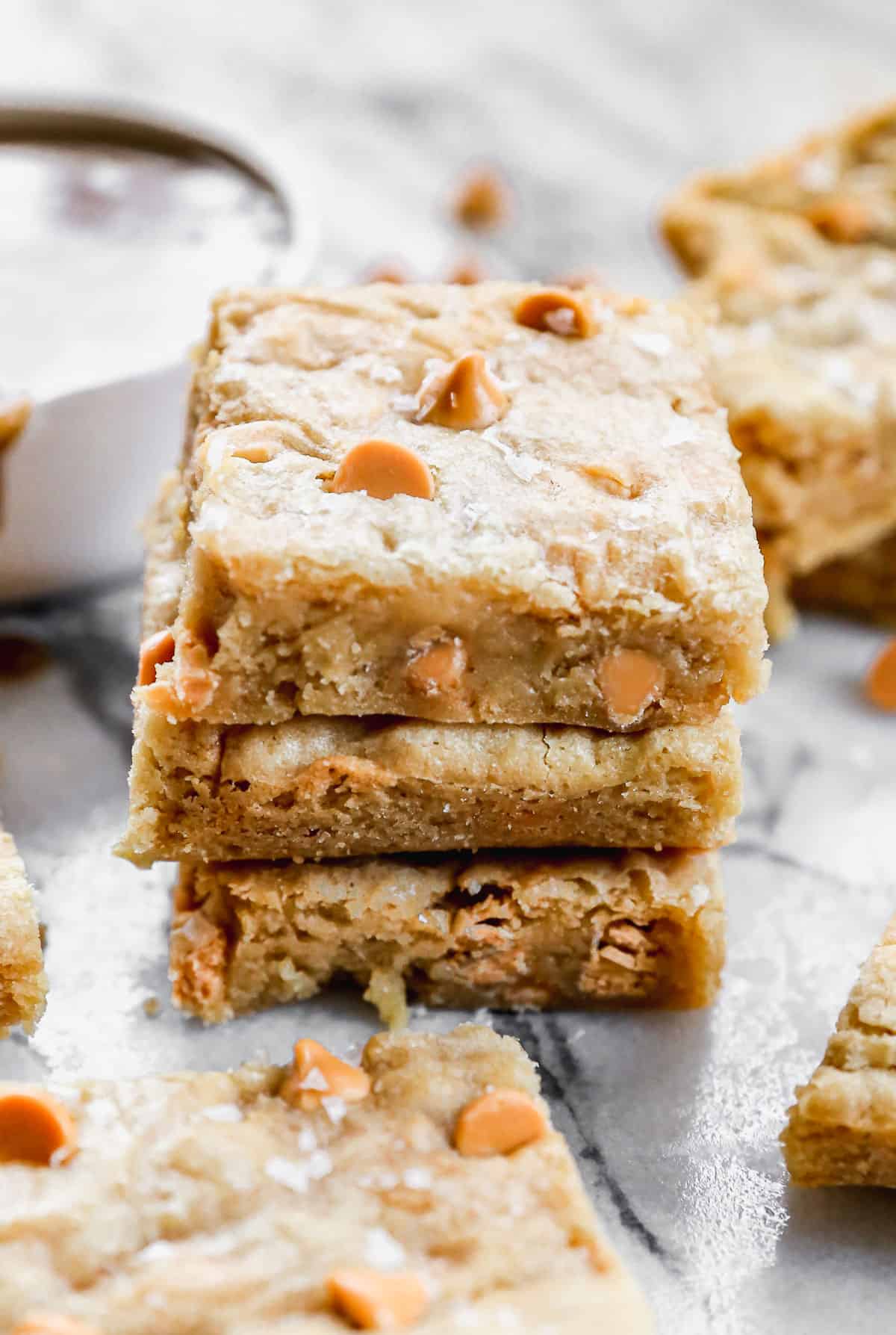 Three easy Butterscotch Bars stacked on a counter, ready to enjoy.