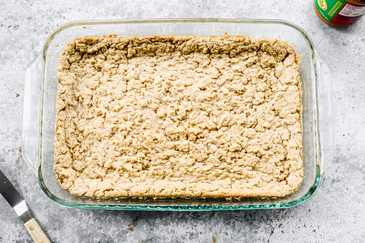 Easy peanut butter bar recipe freshly baked in a glass 9x13 pan.