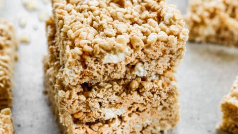 Three browned butter Rice Krispie Treats stacked on top of each other.