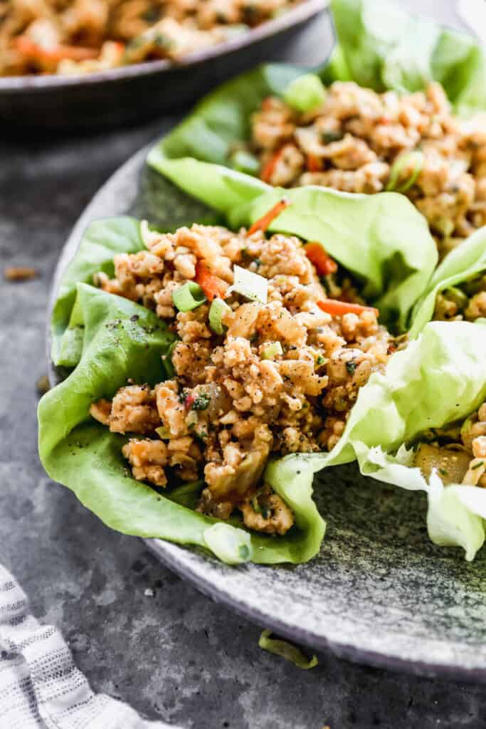 A close up image of a Thai Chicken Lettuce Wrap, ready to enjoy.