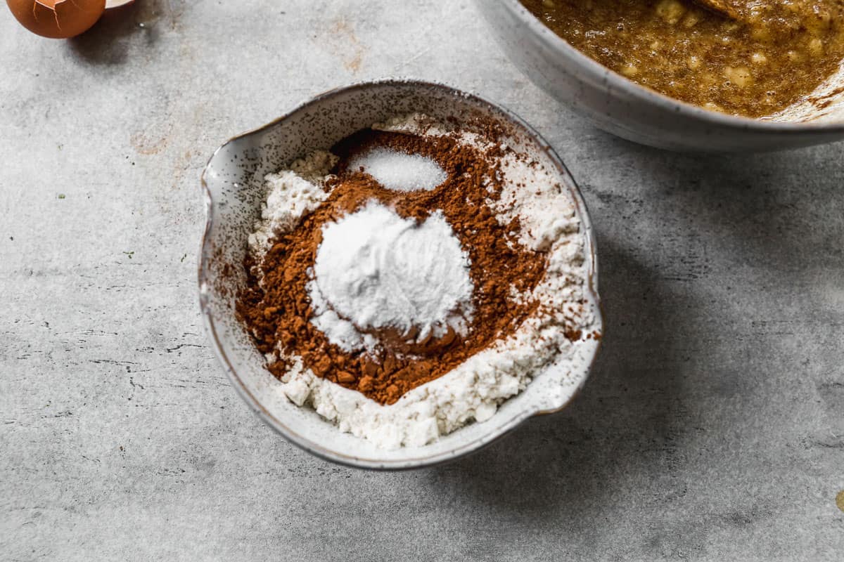 Flour, cocoa, baking powder, baking soda, and salt in a mixing bowl.