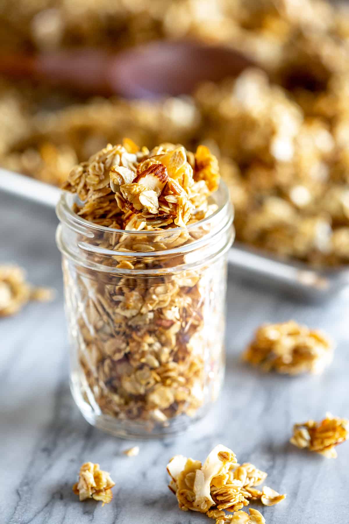 A mason jar filled with fresh crunchy homemade granola.