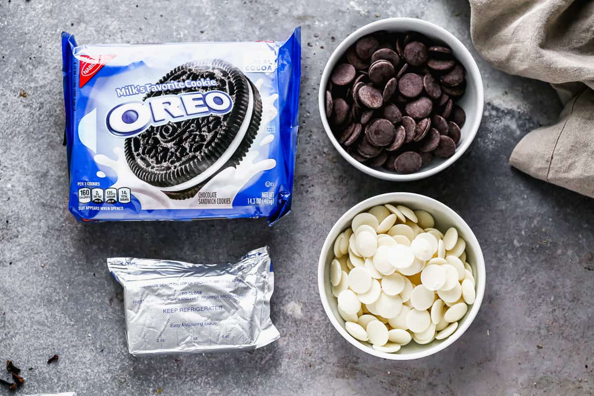 All the ingredients you need to make 3 ingredient Oreo cookie balls: Oreos, cream cheese, and chocolate wafers.