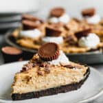 A slice of Peanut Butter Pie on a white plate, ready to enjoy.