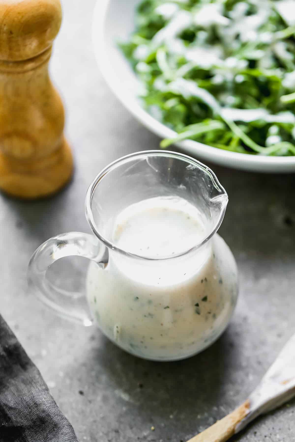 A serving jar filled with homemade Ranch Dressing, perfect for dipping vegetables or pouring on a salad.