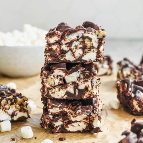 Three squares of homemade Rocky Road candy stacked on top of each other, ready to enjoy.