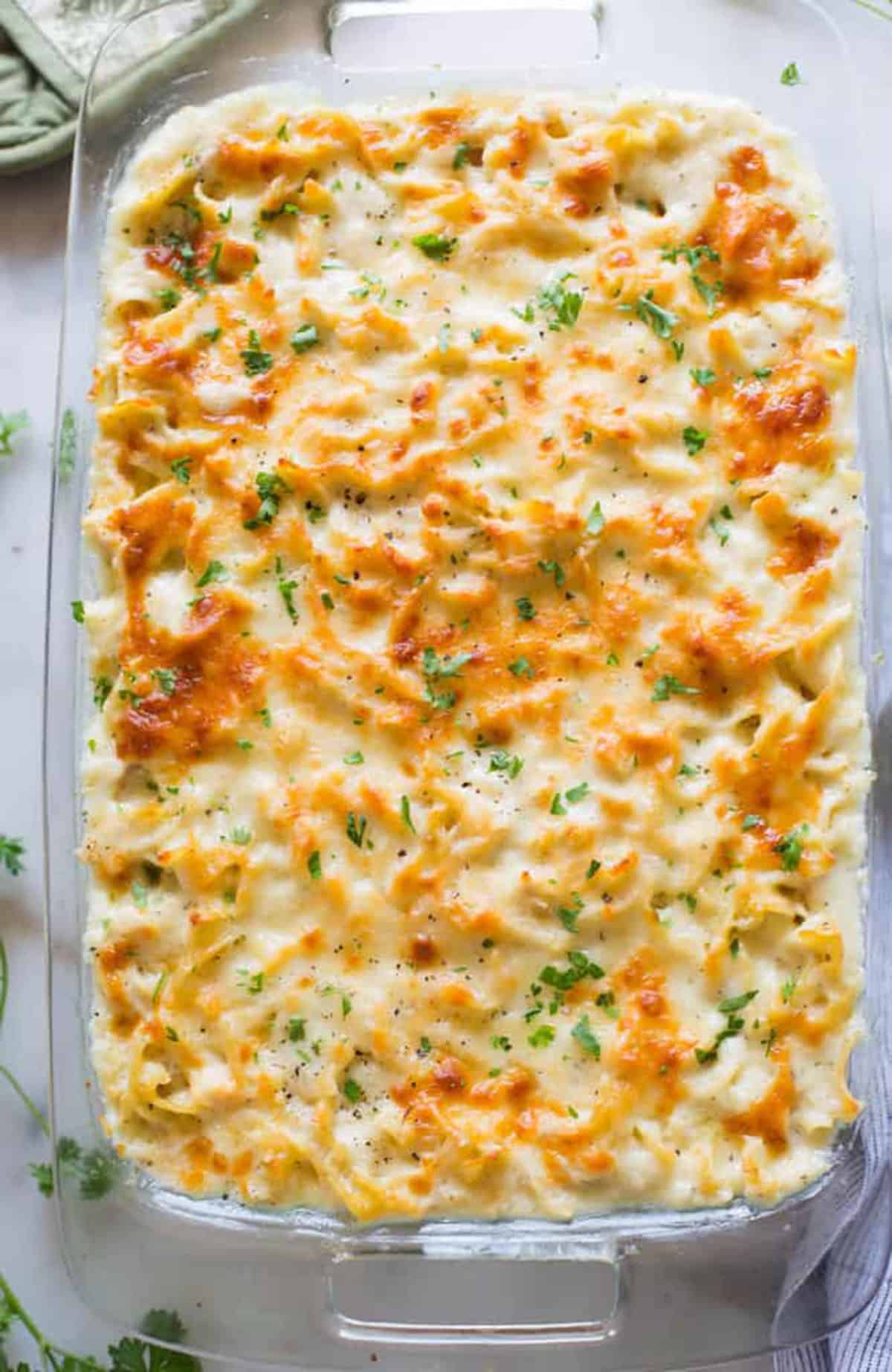 An easy Chicken Noodle Casserole recipe in a glass 9x13 dish, fresh out of the oven.