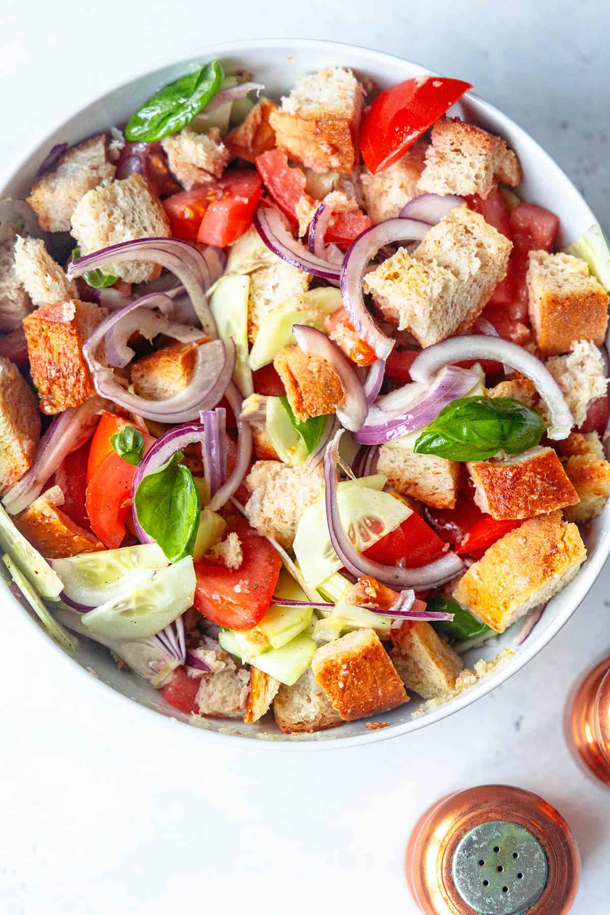 An easy Panzanella recipe in a white serving bowl, ready to enjoy.