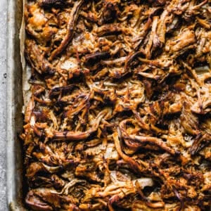 This Mexican Carnitas recipe is flavorful, tender, and only requires 5 minutes of prep. Broil the meat for a few minutes to create those irresistible crispy bits and enjoy on tacos, burritos, salads, or anything!