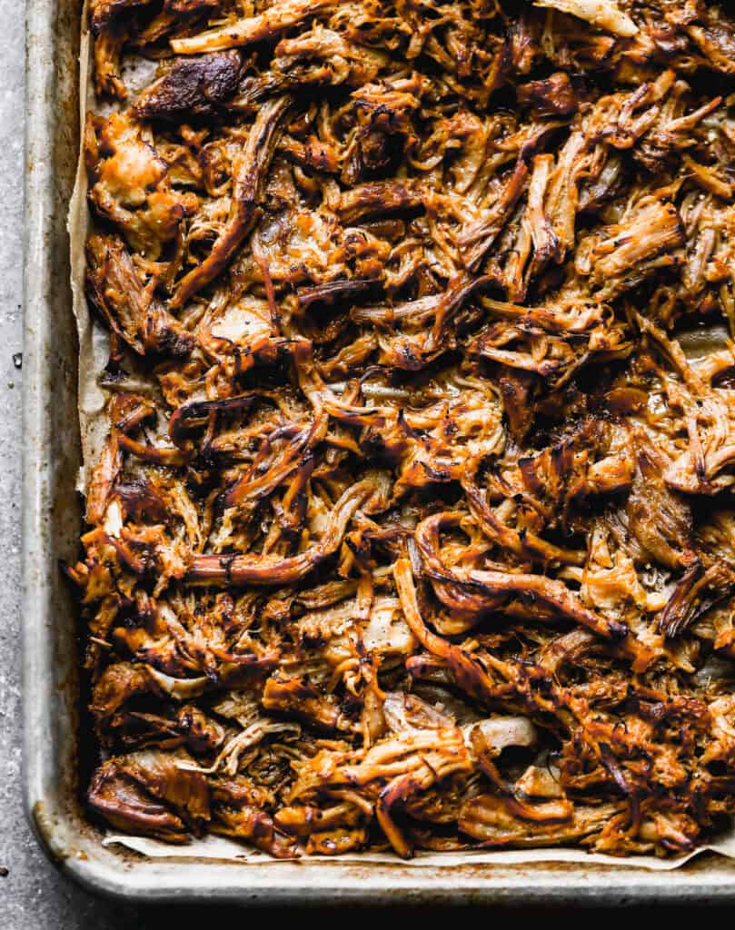 This Mexican Carnitas recipe is flavorful, tender, and only requires 5 minutes of prep. Broil the meat for a few minutes to create those irresistible crispy bits and enjoy on tacos, burritos, salads, or anything!