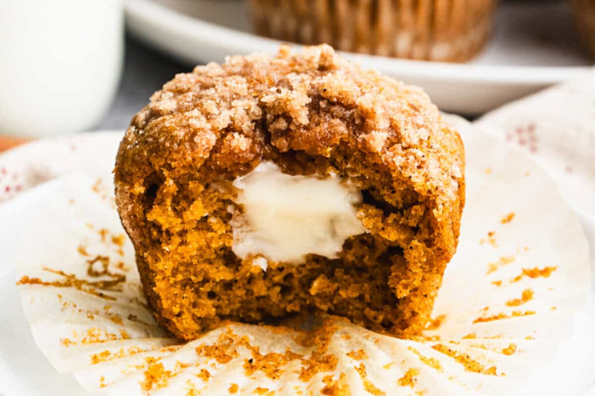 These Starbucks Cream Cheese Muffins recipe is moist, perfectly spiced, and has a creamy center and a crunchy streusel topping. These Starbucks pumpkin cream cheese muffins are better than the bakery and so easy to make at home!