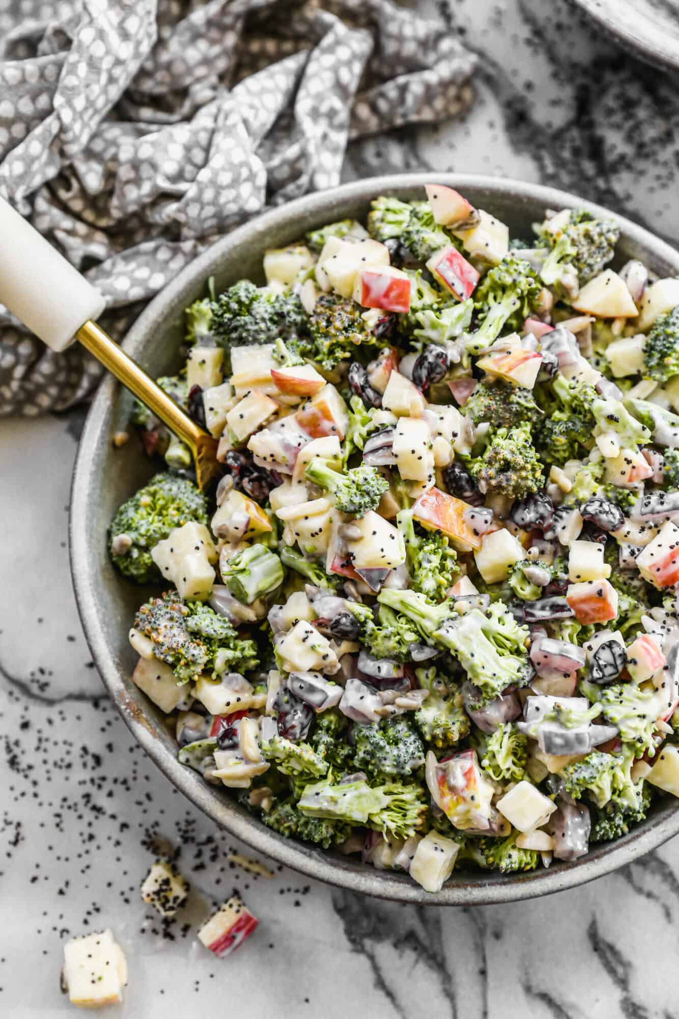This Broccoli Apple Salad recipe is full of fresh broccoli and apples tossed with craisins and onion in a creamy homemade poppyseed dressing.